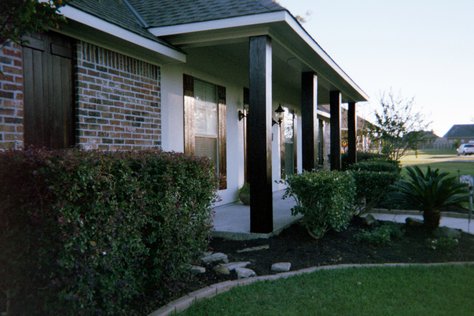 I painted the exterior of this house and stained/varnished the shutters and posts